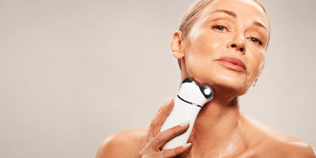 face and neck massager with dual metal heads applied to the neck